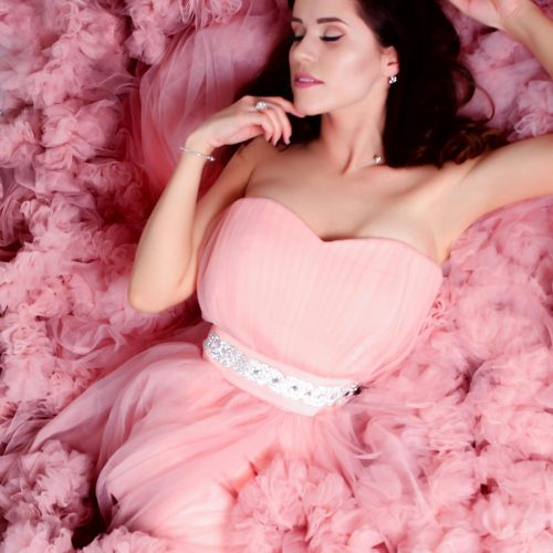 pexels-photo-1059054-1059054 A young woman elegantly posing in a pink strapless dress on pink tulle. Perfect for fashion and beauty themes.