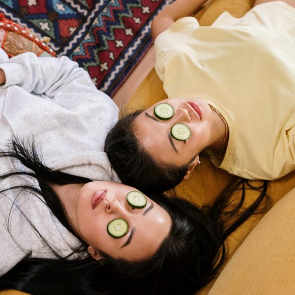 pexels-photo-4004119-4004119 Two friends relaxing at home with cucumber masks in a cozy setting, enjoying a DIY skincare session.